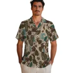 wyoming-cowboys-hawaiian-shirt-personalized-tiki-masks-warm-beige-best-selling.webp